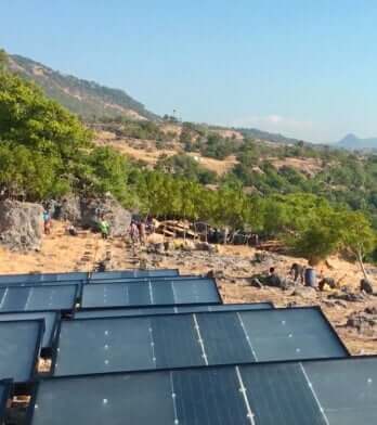source hydropanels on hillside with workers