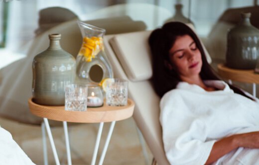 Source water on side table of relaxing spa